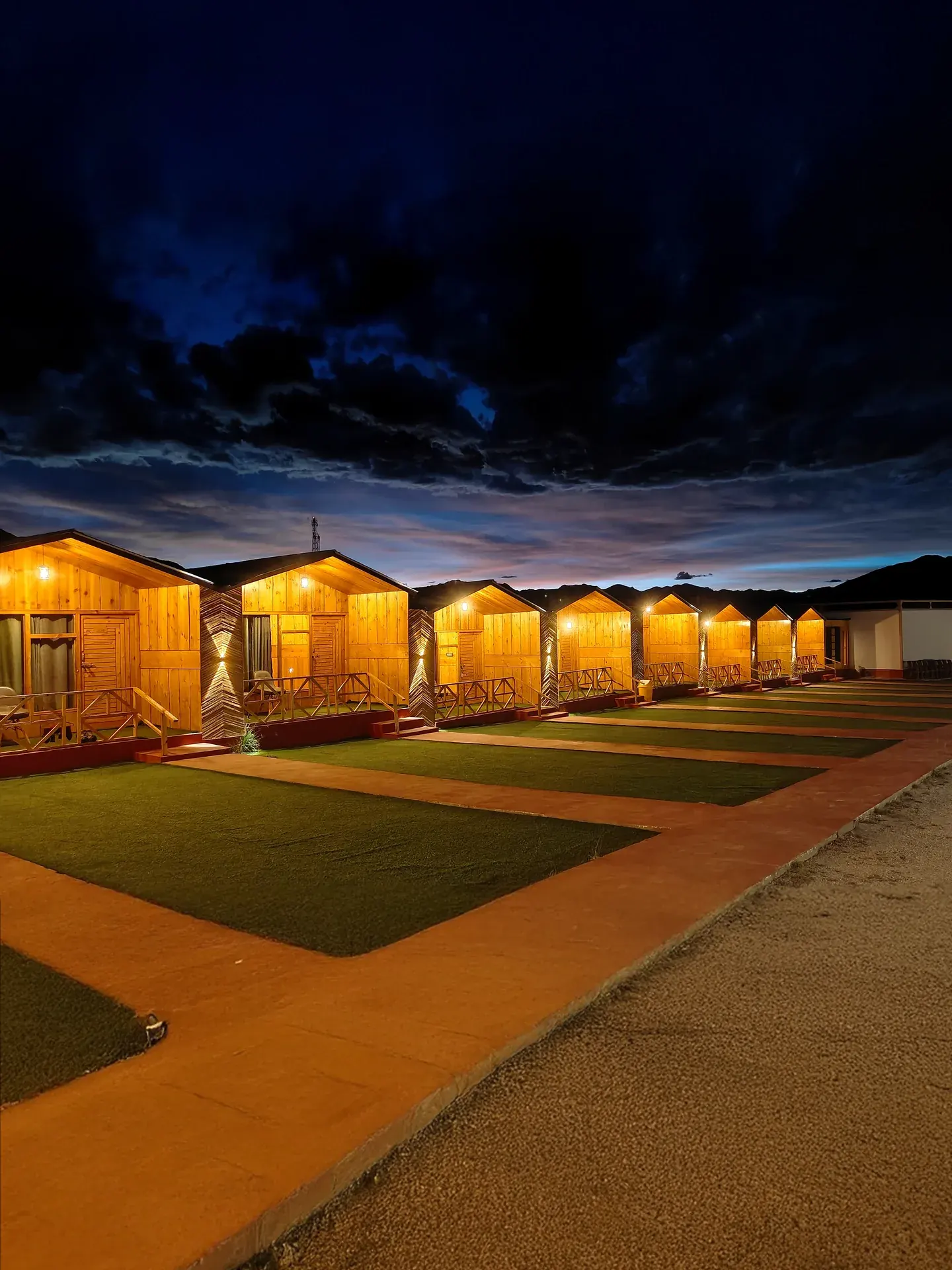 Pangong Pearl — Night walk between cottages